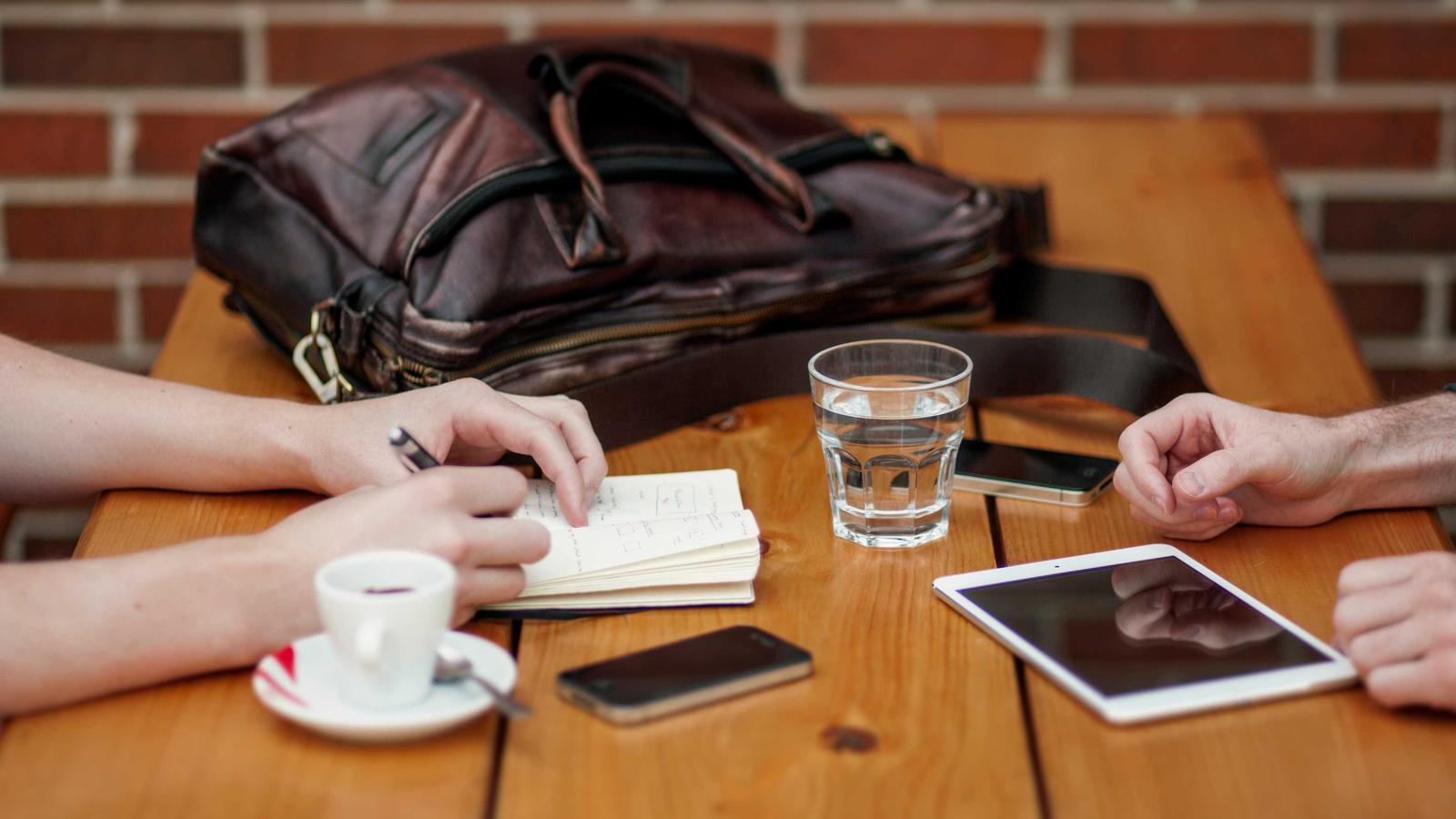 A preparer going through a return with a client across the table